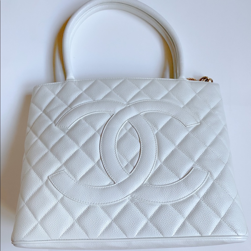 White Chanel tote with gold cc emblem